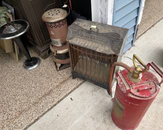 Vintage stoves, ashtray, and pump