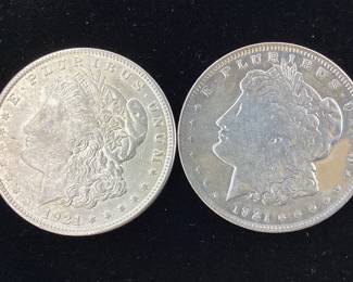  2) 1921 P Morgan Silver Dollars 90 percent silver coin. One has been polished, cleaned