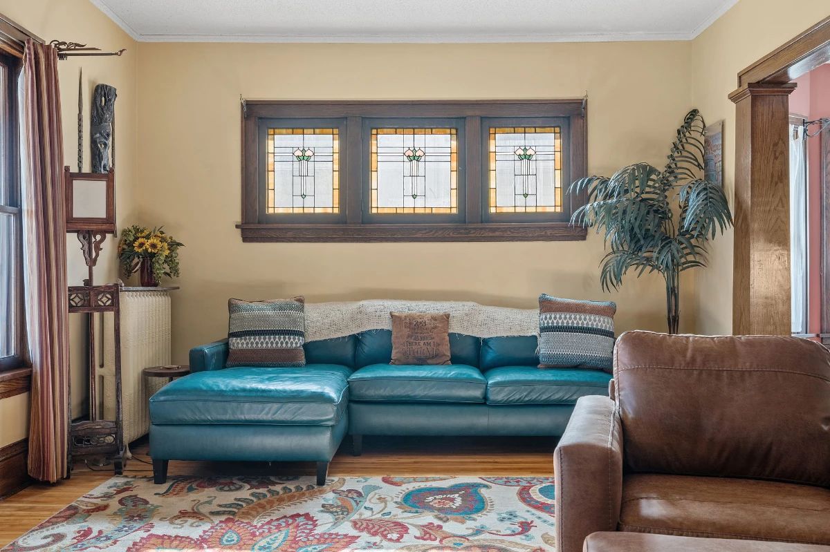Leather sectional, leather arm chair, faux plant, throw pillows, lamps 