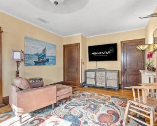 TV, console, unique chair, artwork, floor lamps