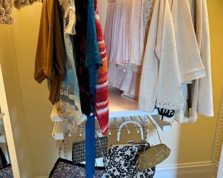 More women's clothing and purses.....