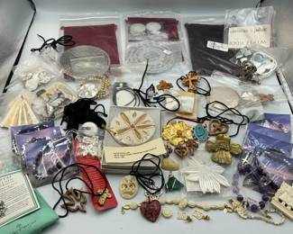 Religious Jewelry and Devotional Items Including Cross Pendants, Rosaries, and Sand Dollar Ornament