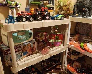 Toys including an easy bake oven and Buzz Light Year figure