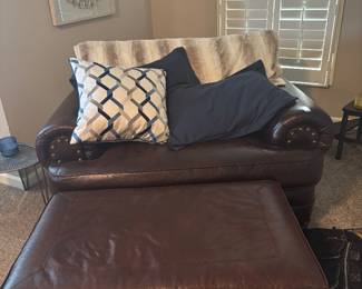 Faux-leather love seat and ottoman