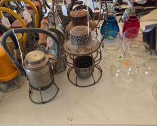 Lanterns and glass hurricane shades 