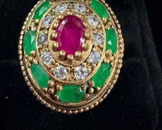 Another beautiful gemstone ring it is supposed to be emeralds and a ruby with crystals