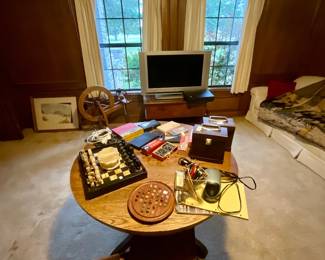 Antique round oak table, chest board, games, etc