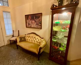 Vintage couch, lighted display cabinet