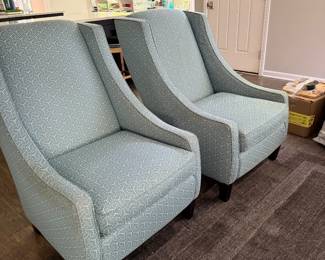 Pair of light blue upholstered accent chairs