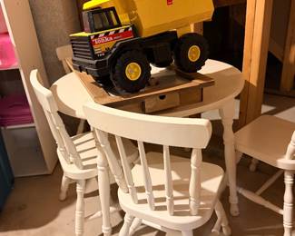 Toy truck with children's table and chairs