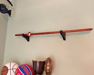 Wall mounted decorative sword with sports items