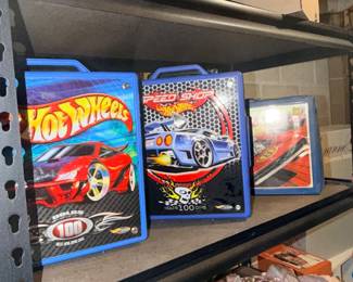 Lots of Hot Wheels cars in cases