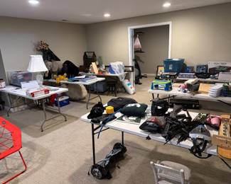Basement table full of tools and household finds