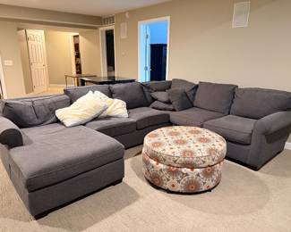 Gray sectional sofa with chaise and ottoman