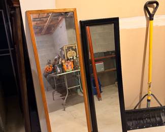 Framed mirror and snow shovel