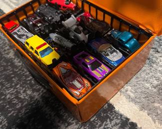 Hot Wheels cars in wooden display case
