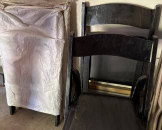 four black folding chairs