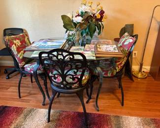 Glass top patio table with four chairs