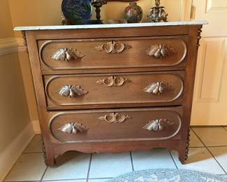 Victorian burled walnut marble top chest of drawers with hand-carved fruit and leaf pull hardware