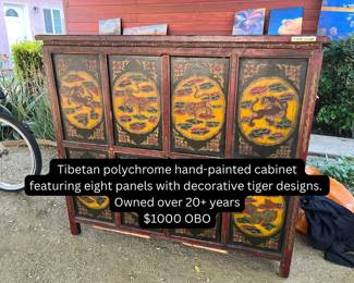 Tipetan Polychrome Hand-painted Cabinet featuring eight panels with decorative tiger designs. Vintage