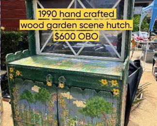 1990 Hand crafted wood garden scene hutch.