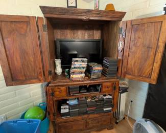 Solid wood organizer or entertainment center, folding wood shutters, lamps, hundred + DVDS