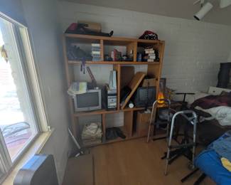 Solid wood organizer with shelves, Himalayan salt lamp, computer, small TV, vintage vinyl records, classic car toys, walker, rocking chair, deep freezer