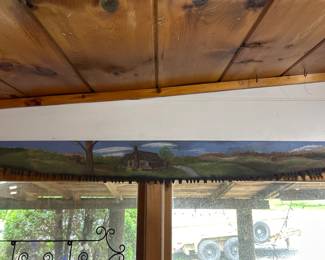 Hand-painted rustic crosscut saw wall art featuring a peaceful cabin landscape scene