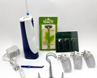 Waterpik Water Flosser, 1970s Gillette Razor, Brookstone Luggage Locks & More Lot #: 127