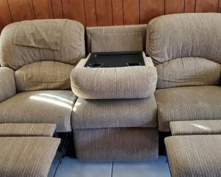 Lazy Boy with Recliners on both ends and a convenient place for food and drink in the middle