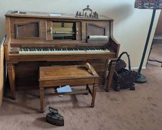 Player piano with many rolls of music