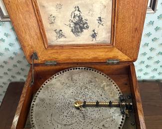 Regina Disc Music Box:  A remarkable Regina disc music box and one of the signature collectibles in this estate. Beautiful craftsmanship, rich wood tones, and timeless appeal for collectors, antique décor enthusiasts, and lovers of mechanical history.