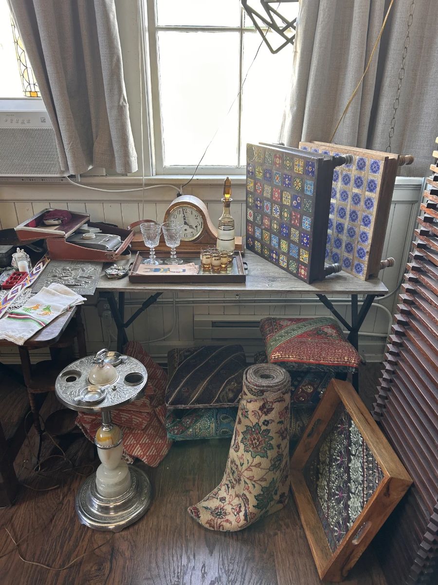 Vintage textiles, small tables, clocks, glassware, framed pieces, and eclectic tabletop decor from the old VSL shop space.