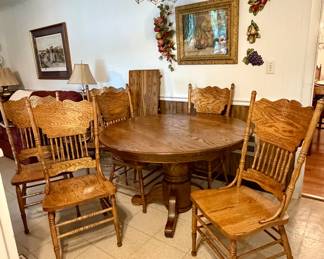 Vintage solid, oak pedestal round kitchen table with six  pressed back spindle chairs with one leaf, extension 
