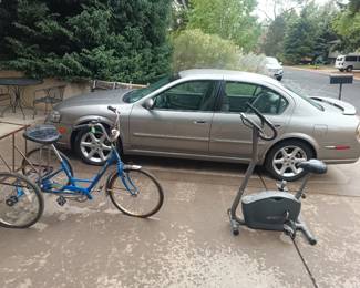 3 wheel bike, 2 wheel exerciser and 2001 Nissan