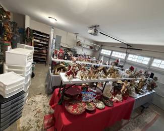 Lots of Christmas items and florals in garage. Several stackable bins.
