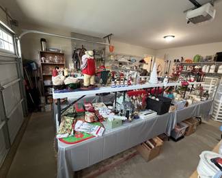 Lots of Christmas items and florals in garage. Several stackable bins.