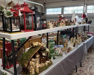 Lots of Christmas items and florals in garage. Several stackable bins.