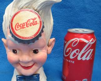 Lot 396. Coca-Cola metal bank in its original box. Weighs just under 7 lbs.