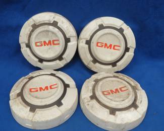 Lot 75. Set of four vintage GMC hubcaps