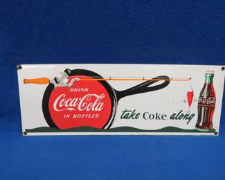 Lot 46. Vintage Ande Rooney porcelain Coke sign, a reproduction of an early 1900s advertisement, and more