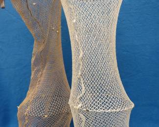 Lot 452. Two 34" deep mesh fish baskets that attach to an oar lock fitting