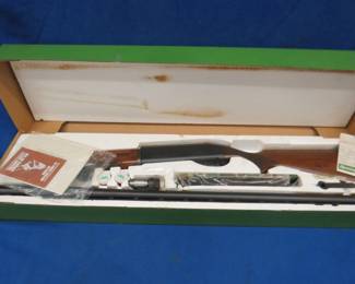 Lot 439. Remington Model SP-10 10-gauge magnum semi-automatic shotgun in the original box. S/N RM002724. Shoots 3 1/2" shells only. 30" ribbed barrel, 3 chokes, manual, and sling. Excellent condition.