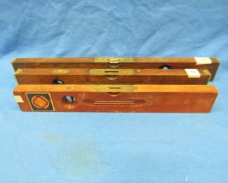 Lot 171. Three vintage wooden levels: 28-inch Stanley with both vials intact. 24-inch Keen Kutter with both vials intact. 22-inch Richards & Conover with both vials intact.