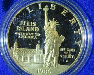 Lot 105. 1986 Proof silver Liberty dollar and half dollar set, gold coin is not included. The dollar coin is 90% silver with .77 troy ounce of silver