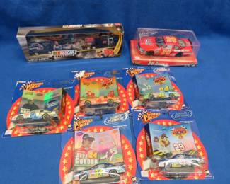 Lot 251. NASCAR collectible die-cast cars, some are Looney-Tunes