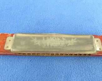 Lot 281. P. Pohl Lucky Strike tremolo harmonica in fair condition. M. Hohner 3 18" Piccolo harmonica in the key of D. made in Germany. Excellent condition.