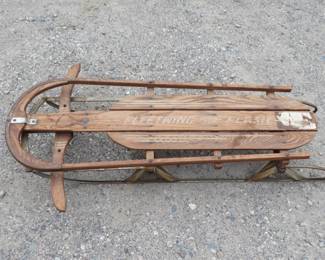 Lot 127. Fleetwing Flash Spring Top iron runner sled. Approx. 48 inches