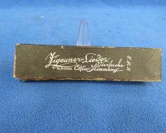 Lot 287. Figeuner-Leider Vierfache 40-hole octave harmonica in the box. Sounds great. The box is in poor condition