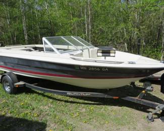 Lot 419. 1992 Quantum model 2100SB 21' open MBoat with a 155HP Mercruiser inboard motor and a matching Quantum bunk trailer: See auctionmn.com for details.